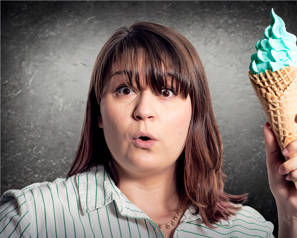 surprised woman holding a green ice cream cone the power of brand photography