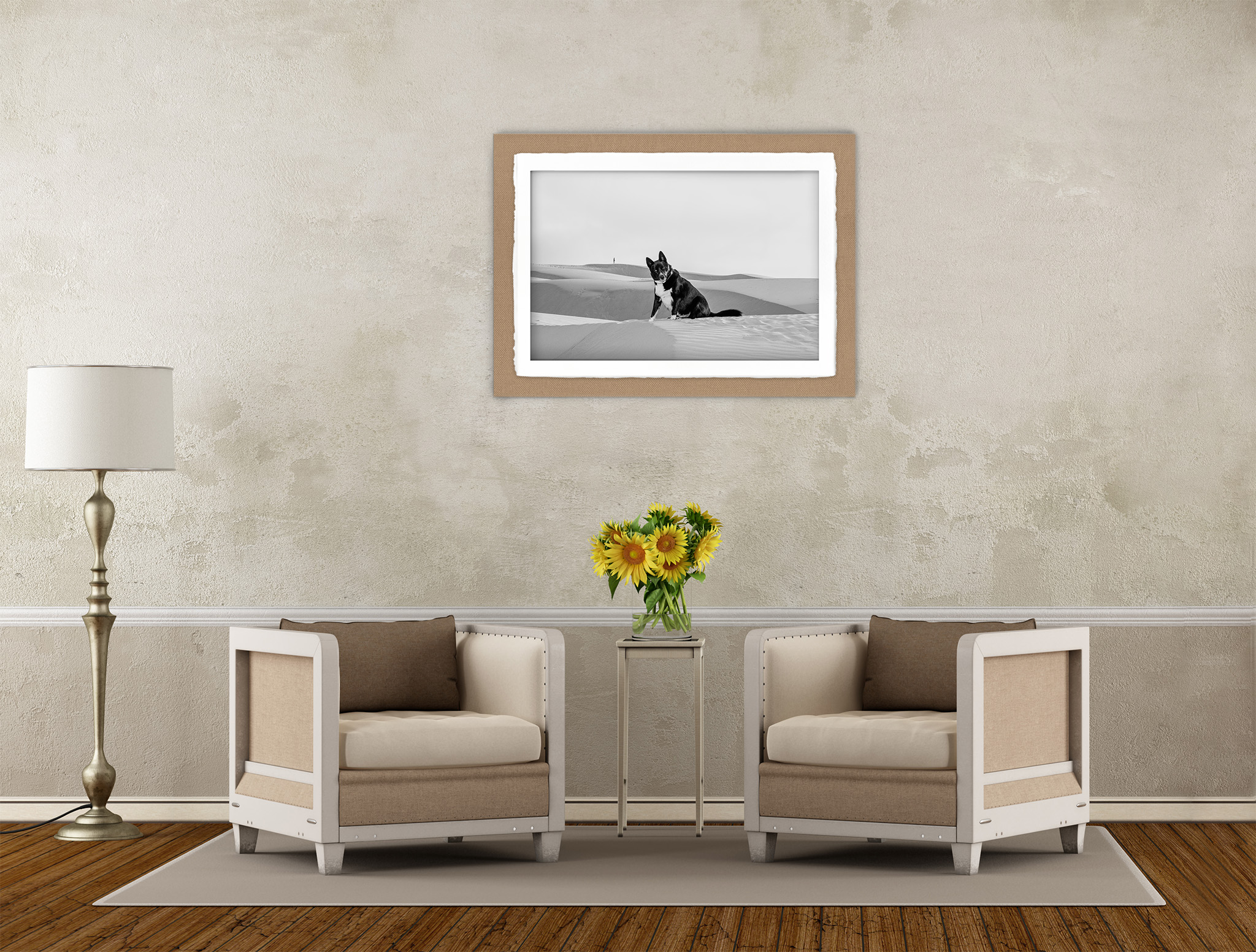 image shows a tan room with two tan chairs and lamp. There is a framed dog photo on the wall behind the chairs. The perfect pet photographer in Tucson will help you design a perfect wall art collection